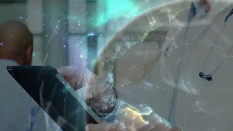 Presenter tapping tablet in conference hall, demonstrating rotating 3D globe Stock Footage 312827541