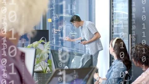 Presenter tapping tablet, drawing diagram on glass, creating data overlays for Stock Footage 334694045