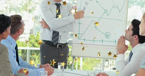 Presenter uncrossing and tracing graph arrow circling letter A while team noting Stock Footage 317228577