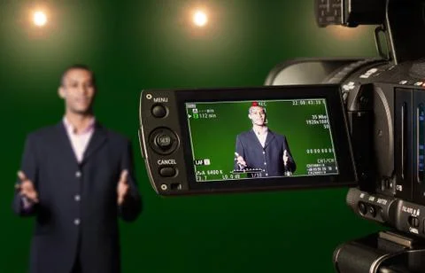 Presenter in the viewfinder of a digital video camera Stock Photos