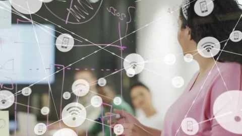 Presenter writing timeline and pie chart on glass initiating network icons Stock Footage 317600486