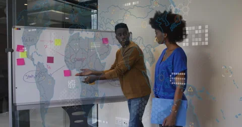 Presenters placing pink note on whiteboard map and causing overlay linking Stock Footage 316089983