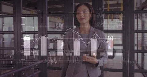 Presenting executive analyzing bar graphs on digital display panel in office, Stock Photos