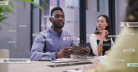 Presenting man in blue shirt with tablet, sharing data using floating overlays Stock Photos
