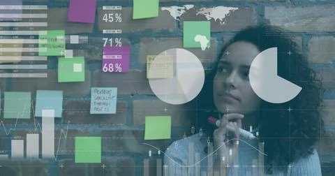 Presenting manager pointing at brick wall with notes in meeting room, projecting Stock Photos