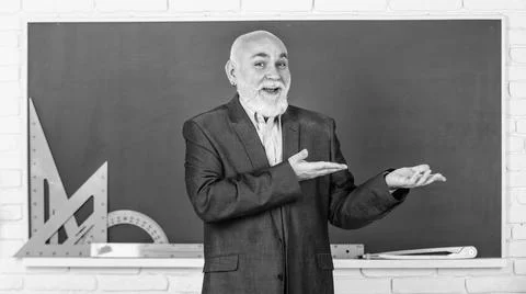 Presenting product. get knowledge here. senior man teacher use math tools Stock Photos
