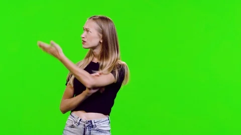 Presenting a product or a text by a young model over green screen. 3 takes. Stock Footage 113860642