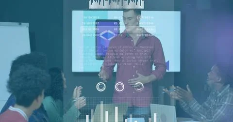 Presenting speaker in red button-up talking at meeting table, with display Stock Photos