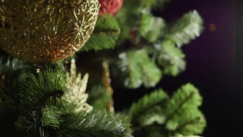 Presents are placed around the bottom of the Christmas tree. Slow motion. HD Stock-Footage 83531627