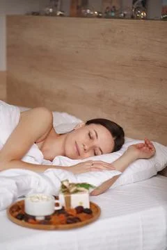 Presents, coffee and sweet sleeping woman Stock Photos