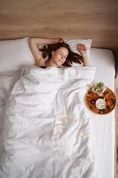 Presents, coffee and sweet sleeping woman Stock Photos