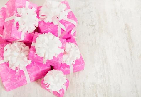 Presents gift boxes stack, birthday in pink color for female or woman Stock Photos