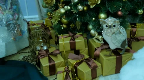 Presents under decorated Christmas tree Video stock 68773825