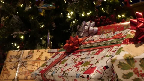 Presents under lit Christmas tree. 4K. Stock Footage 167089255