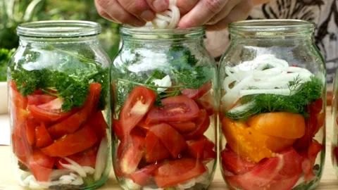 Preservations, conservation Salted pickled tomatoes in a jars on an wooden table Stock Footage 249282005