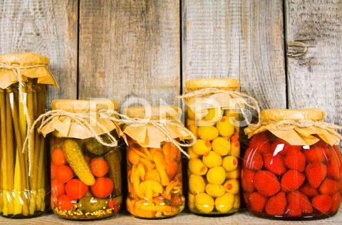 Preserved Food In Glass Jars, On A Wooden Shelf
