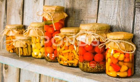 Preserved Food In Glass Jars, On A Wooden Shelf