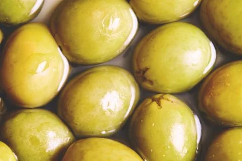 Preserved pickled green olives Stock Photos