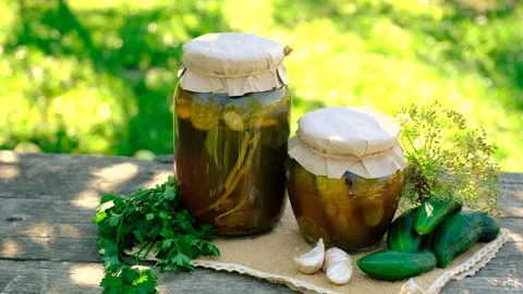 Preserving cucumbers in a jar. Selective focus. Stock Footage 295867381