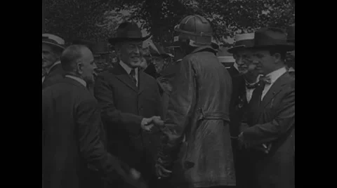 President Woodrow Wilson and Postmaster Gen. Burleson inspecting biplane Stock Footage