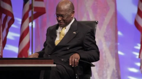 Presidential Candidate Herman Cain - Sitting, getting question Stock Footage