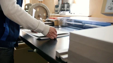 Press business - worker works at polygraph machine, printing industry Stock Footage 76932508