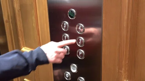 Press on a button in an elevator, lift Stock Footage 96343034