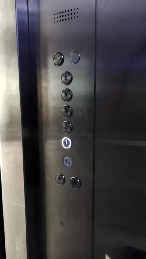 Press The Button for The First Floor in An Elevator Stock Footage 319969569