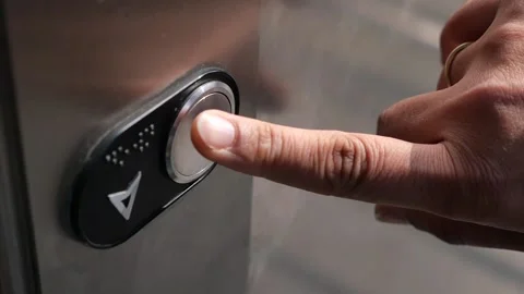 Press button to go down in elevator at office building Vídeos de archivo 332688815