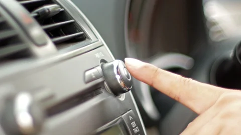 Press the car audio button. Stock Footage 95411795