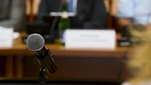 Press conference. A public speaker talks to a television camera Stock Footage 221349822
