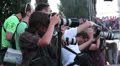 Press correspondents taking photos of event looking at their cameras HD Footage