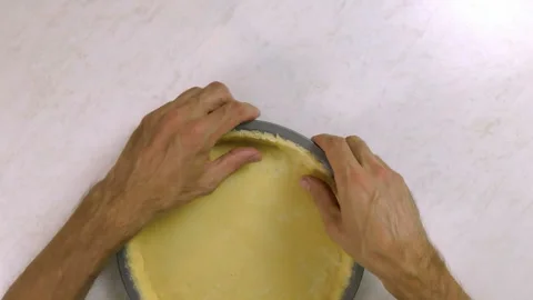 Press dough sheet into baking tin Stock Footage 100195768