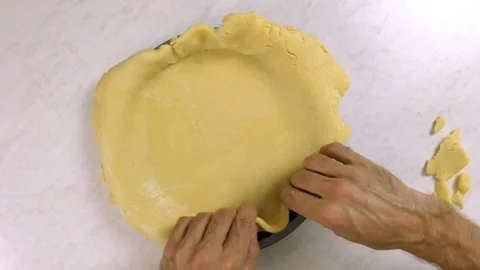 Press edges of pastry case in baking tin Stock Footage 100195666