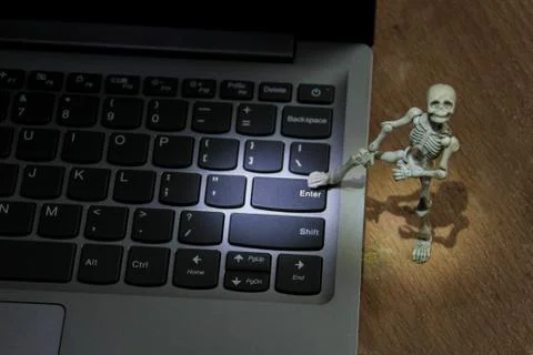 Press the enter button by feet Stock Photos