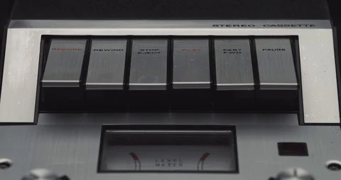 Press fast forward button on retro audio cassette tape player recorder Stock Footage 121188485