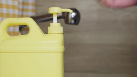 Press liquid dispenser bottle. Apply hand sanitizer. Use dish soap. Stock Footage 344831444