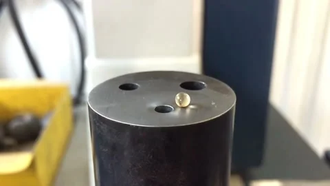 Press machine crushed the ball Stock Footage 93313524