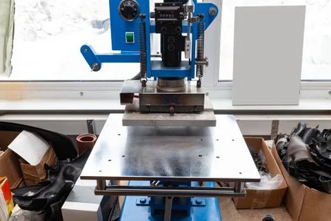 Press machine in the workshop for doing the embossed logo and letters on the  Stock Photos