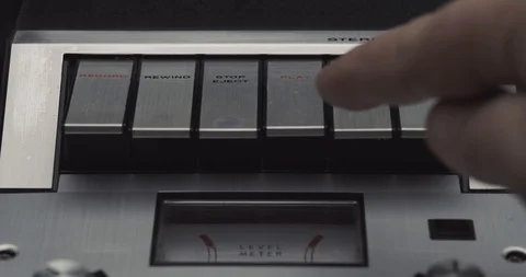 Press play and then pause button on retro audio cassette tape player recorder Stock Footage