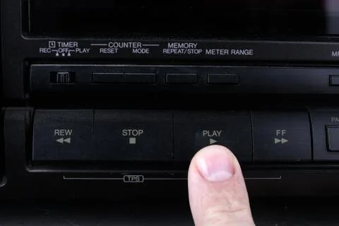Press play button on retro audio cassette tape recorder. Stock Photos