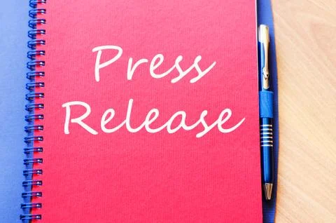 Press release write on notebook Stock Photos