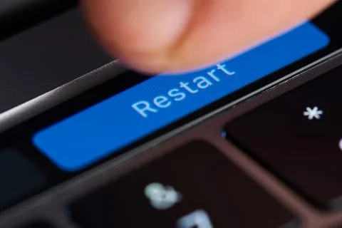 Press restart button Stock Photos