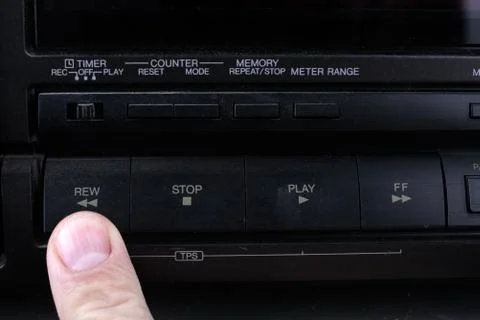 Press Rew button on retro audio cassette tape recorder. Stock Photos
