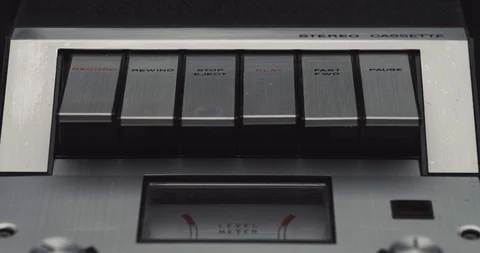 Press rewind button on retro audio cassette tape player recorder Stock Footage 121188364