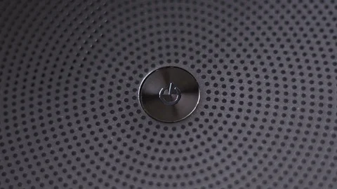 Press silvery power button. Close-up. 4K. Stock Footage 87917541
