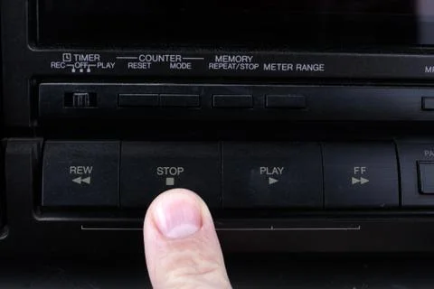 Press stop button on retro audio cassette tape recorder. Stock Photos