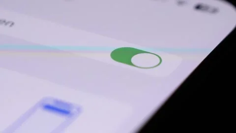 Press toggle enable button on Iphone screen, close up view Stock Footage 247603964