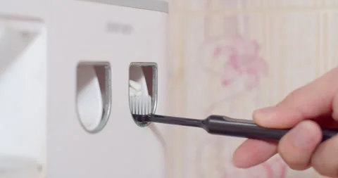 Press toothpaste from an automatic machine and show off on camera. Stock Footage 263334194