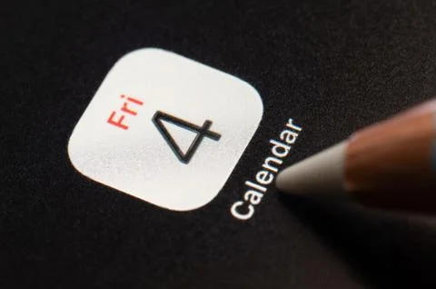 Press touch on Apple calendar mobile application Foto stock